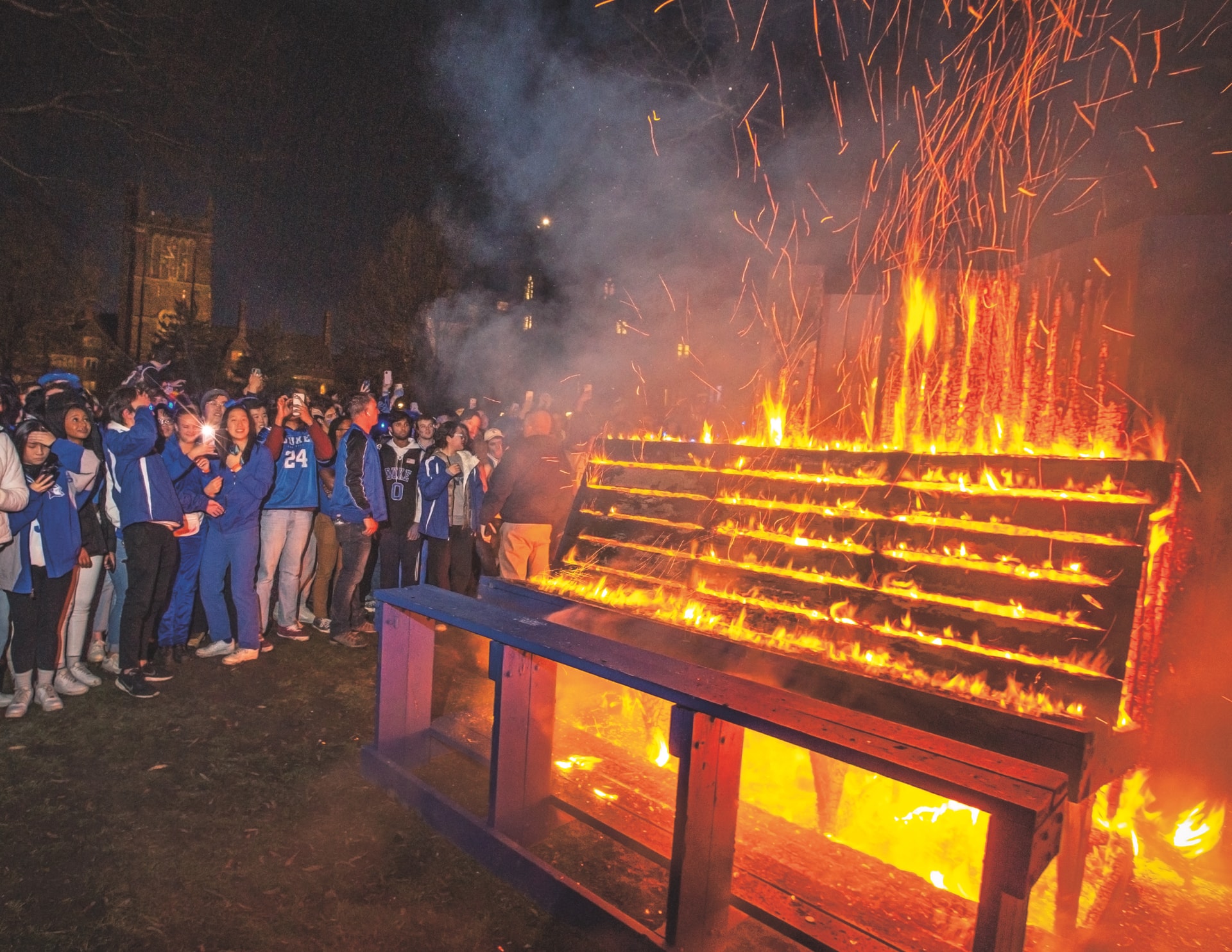 Students light up the benches after a win over UNC in February 2022. Photo by Chris Hildreth