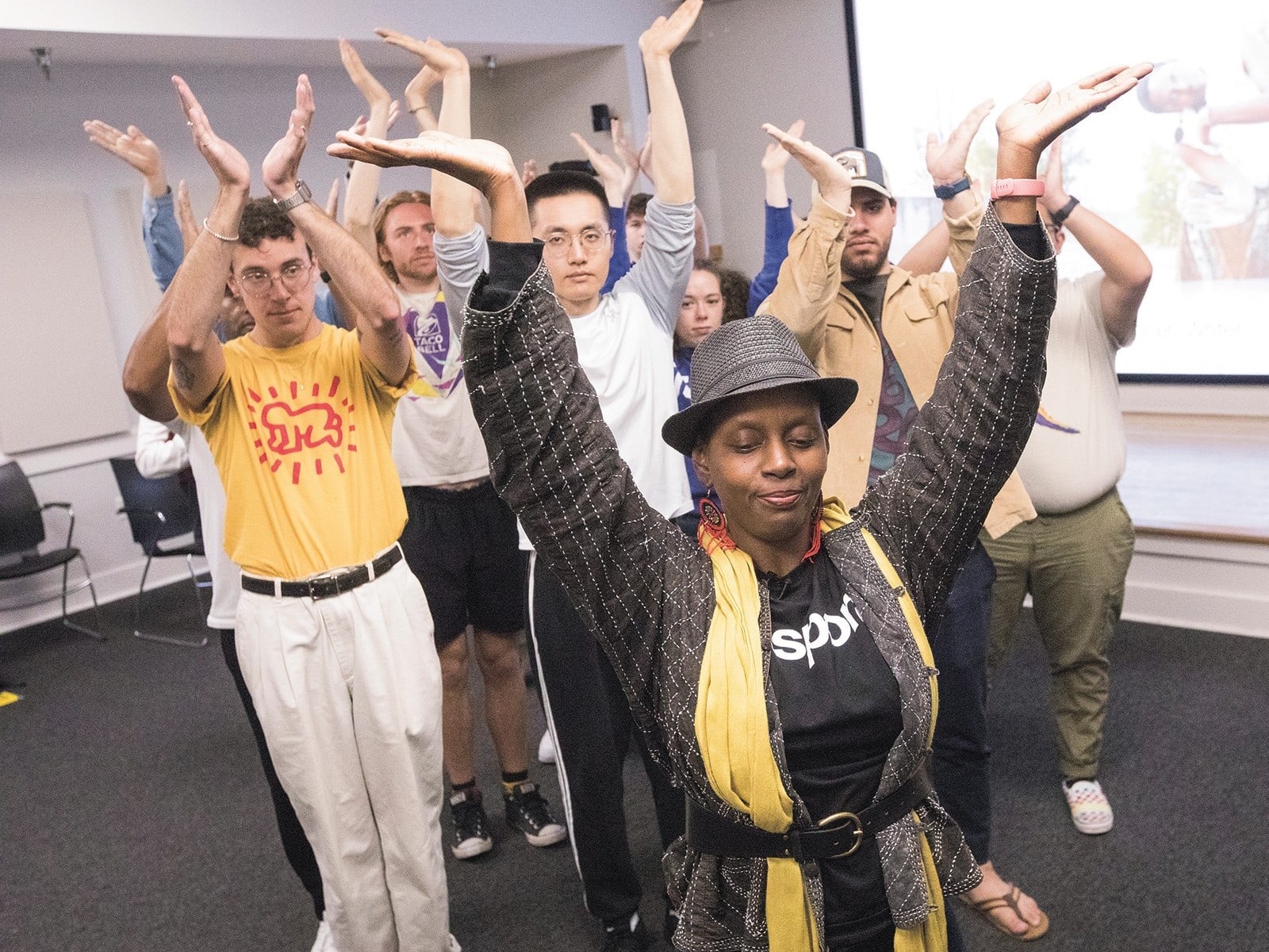 Durham choreographer and dancer Aya Shabu (with yellow scarf) leads the Fieldwork Methods: America’s Hallowed Ground class through movement-as-art.