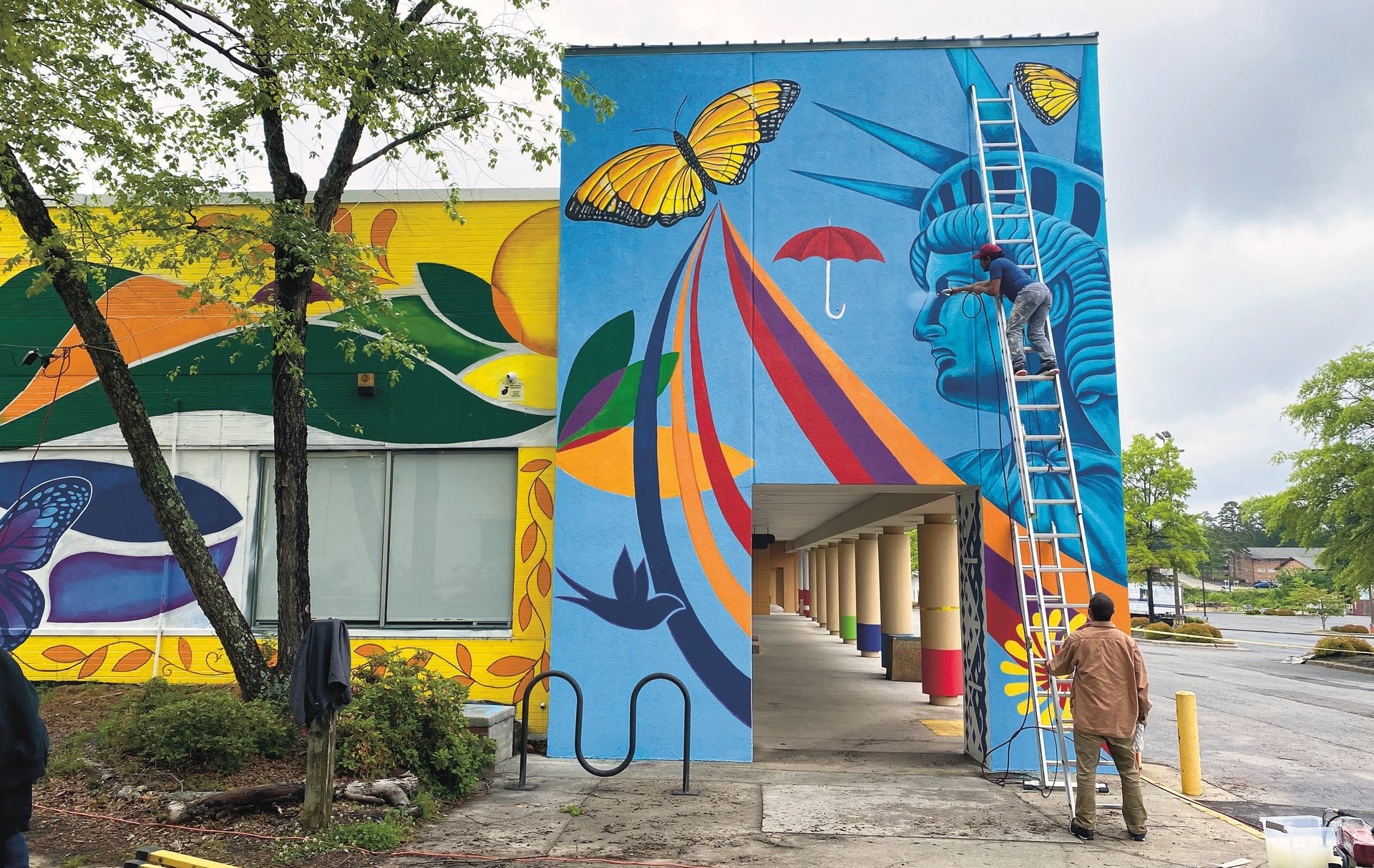 Mexico muralist Cornelio Campos working on a mural