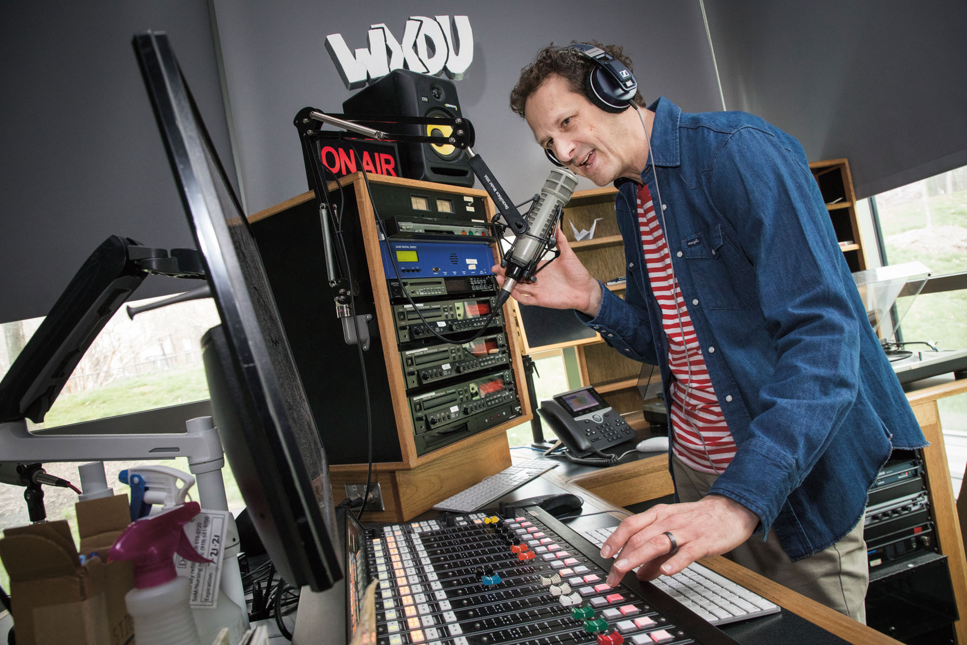 Photo of Gavin Yamey in radio studio