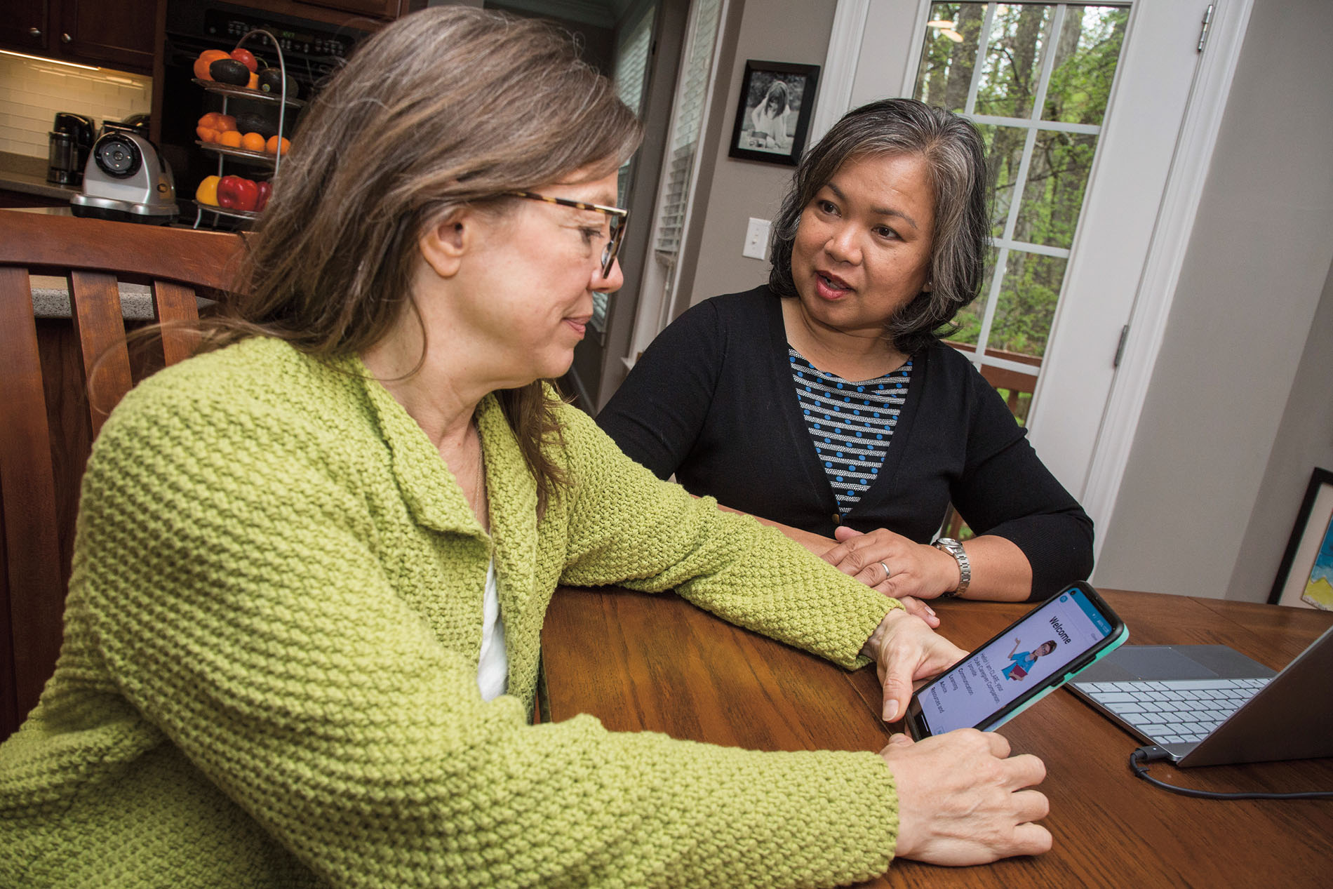 Photo of Cristina Hendrix checking in with Anne Rudolph