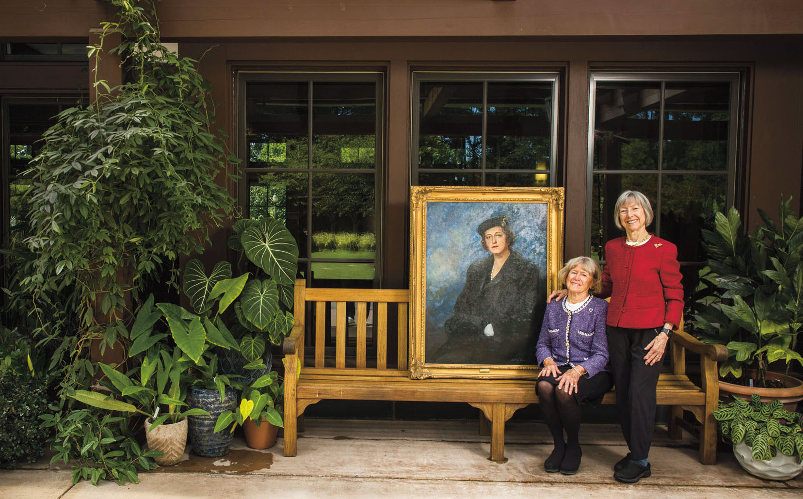 Sisters Mary Biddle Jones, seated, and Rebecca Biddle Kirkland at the Doris Duke Center with a portrait of their grandmother Sarah P. Duke.