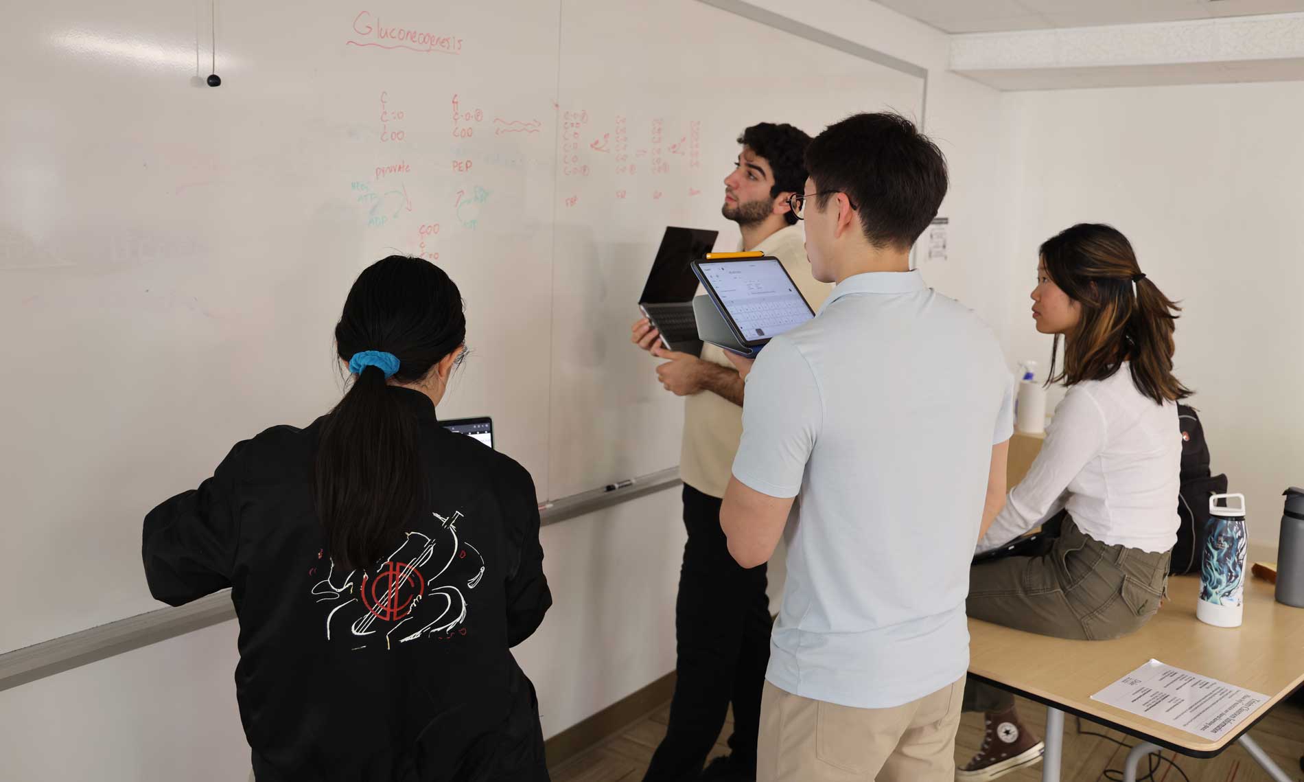 Students at white board