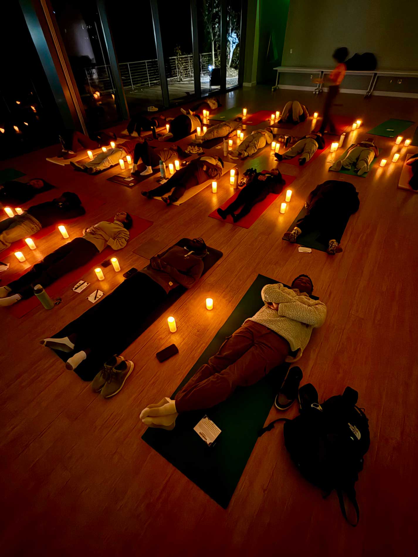 Students participating in a candlelit sound bath
