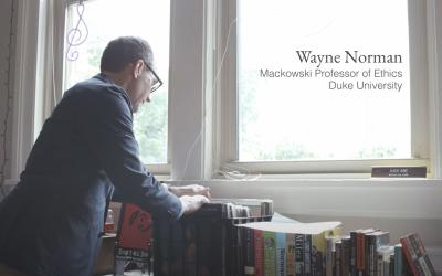 Wayne Norman looking at albums