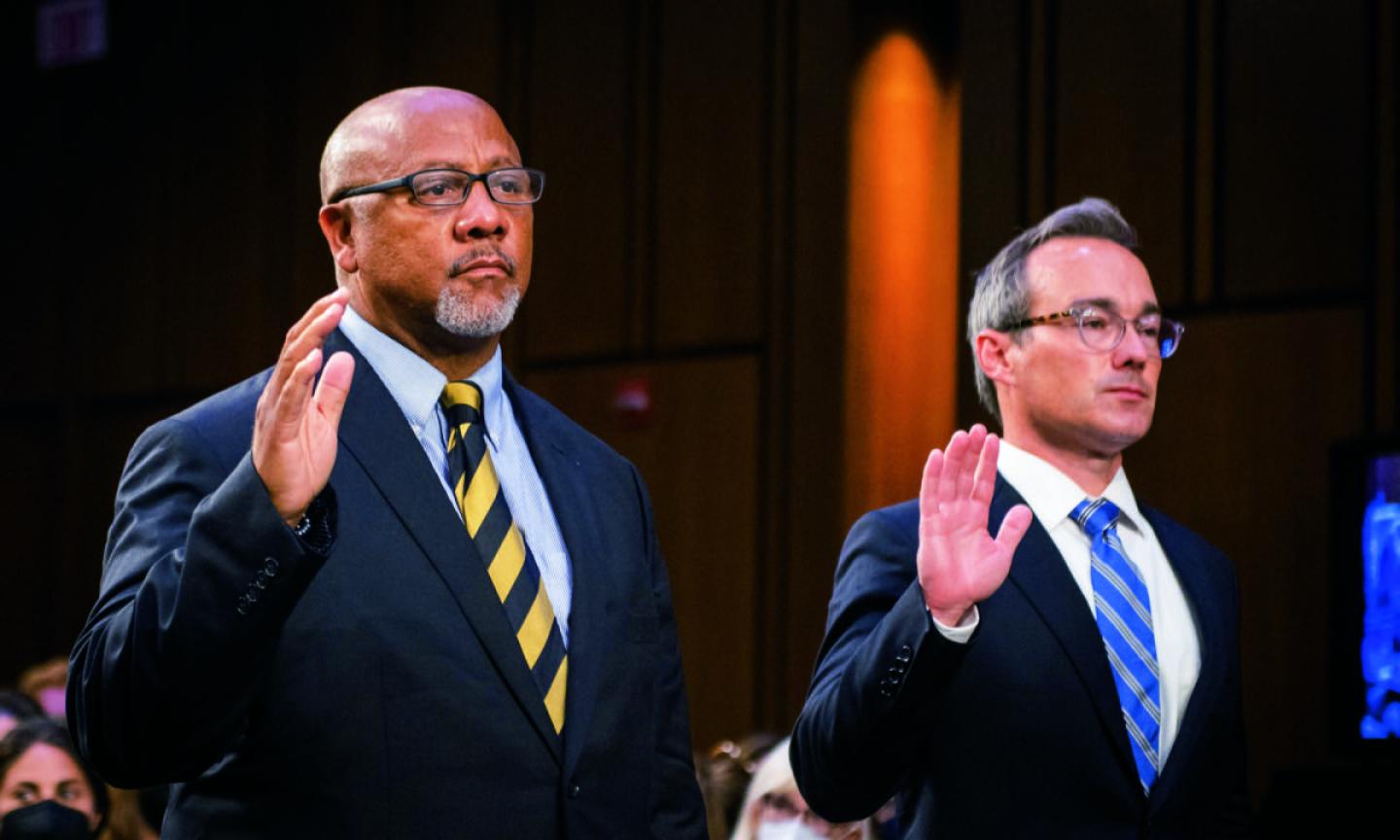 Philip Smith, founder and president of the national African American Gun Association, left, and Duke Law professor Joseph Blocher are sworn in during a Senate Judiciary Committee hearing to examine the Highland Park attack.