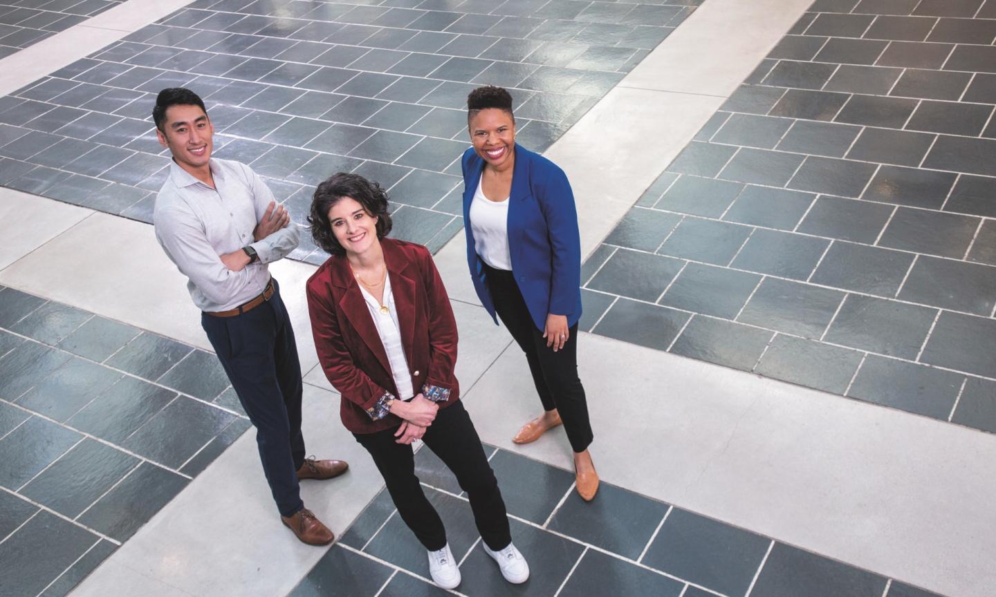 Professor Jamie Jones, center, with student founders Kandasi Griffiths, right, and Willis Wong in the Fox Center, just outside the new entrepreneurship co-working space due to open later this year.