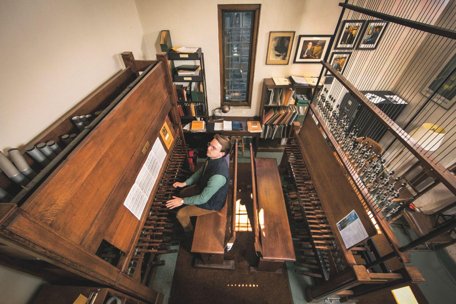 THUMBNAIL: Duke Divinity School graduate student Chase Benefiel rehearses a recital on the practice side of the carillon inside the tower of Duke Chapel.