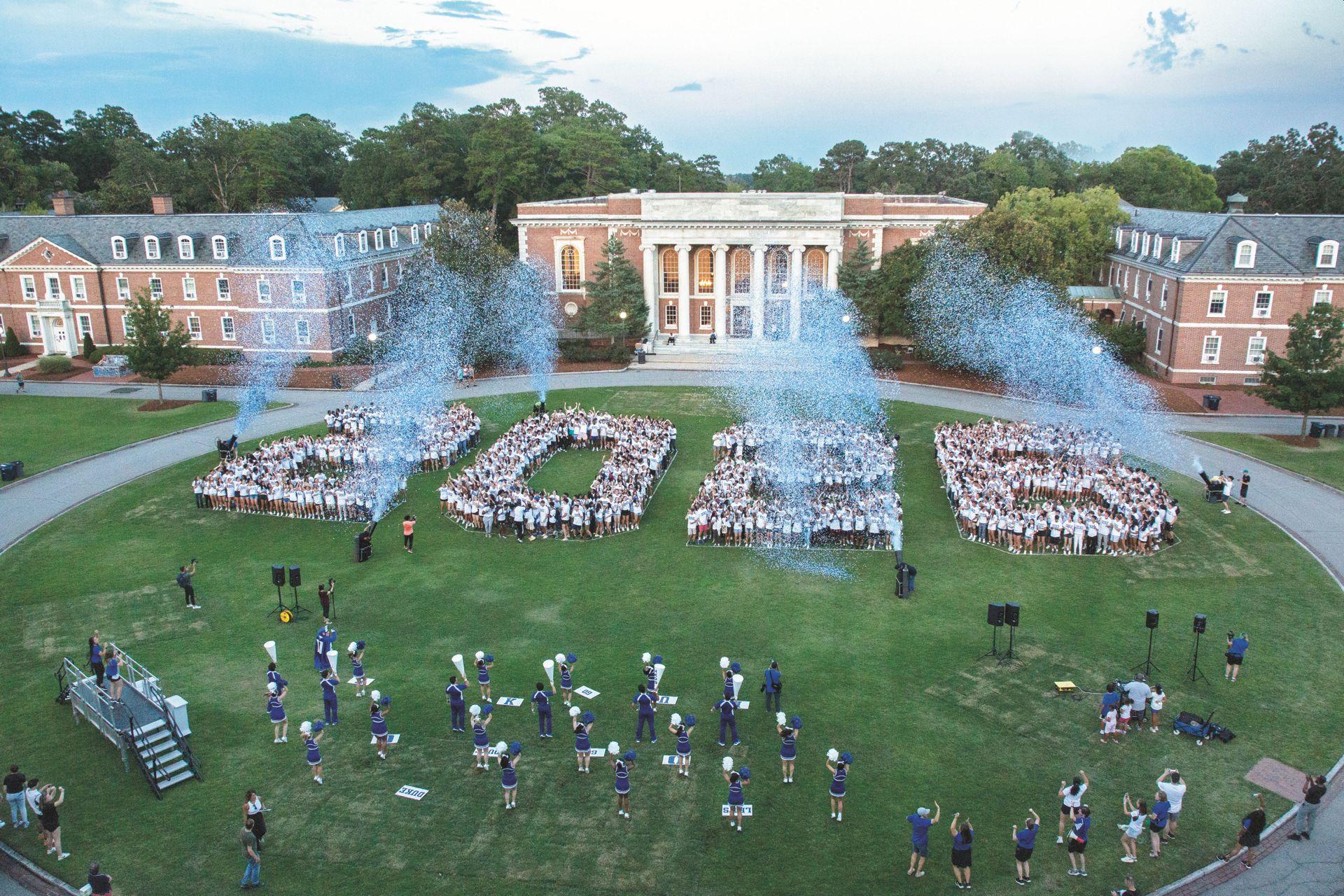 THUMBNAIL: Class of 2026 gathered together on the lawn of the campus in an aerial photograph. 