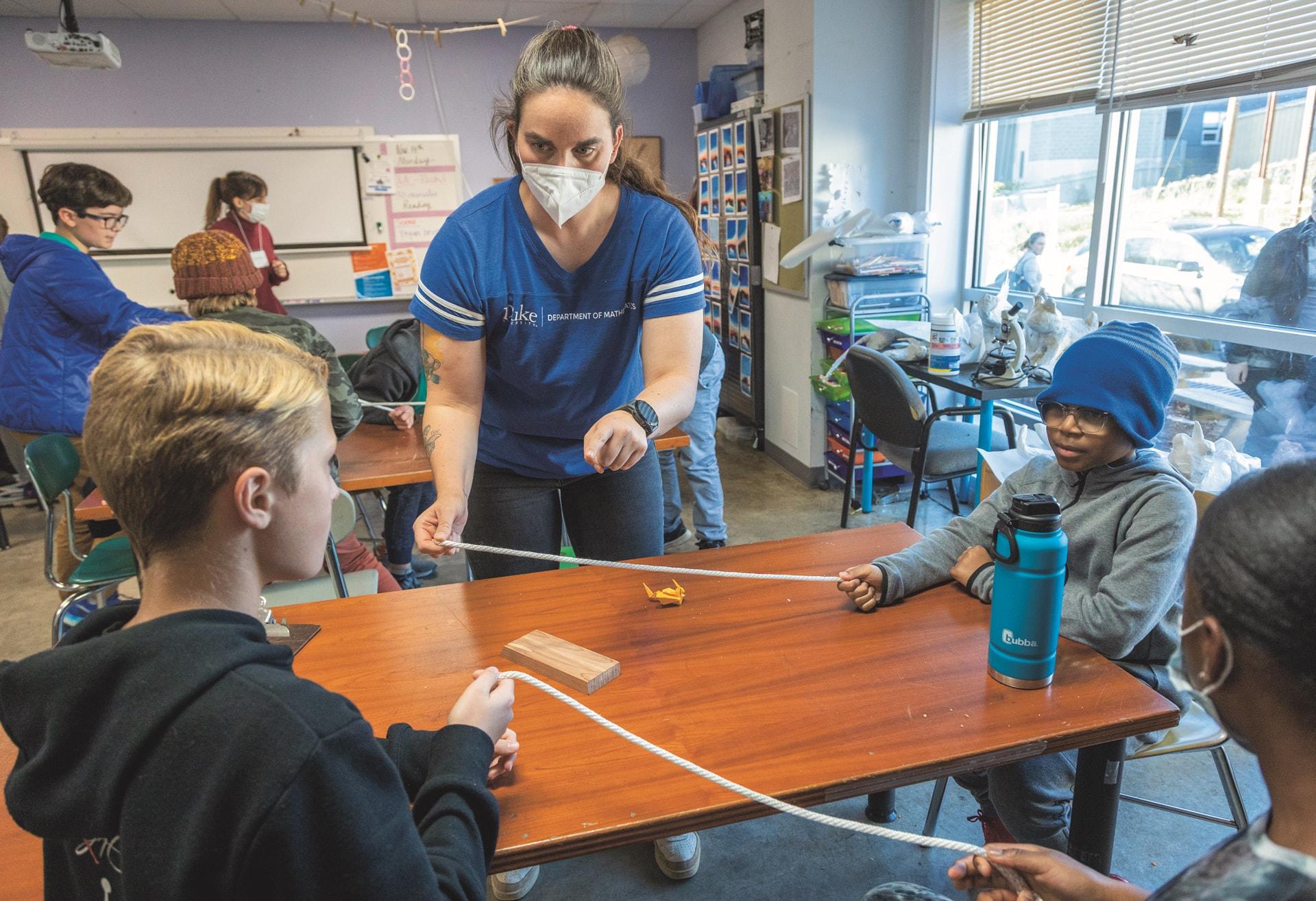 THUMBNAIL: Duke mathematician Maggie Regan works with sixth-graders at Durham’s Central Park School for Children 