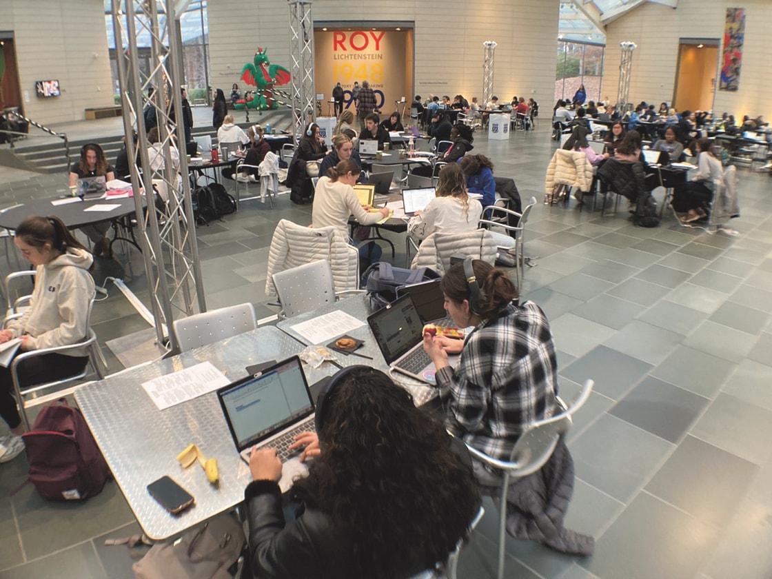 THUMBNAIL: Nasher Museum study hall with students focusing on laptops